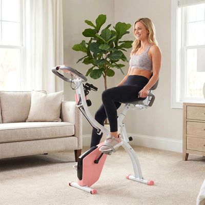 HOMCOM Cyclette Pieghevole 2 in 1, Resistenza Magnetica Regolabile 8 Livelli, Cyclette da Casa Silenziosa con Sensore Cardiaco, Sedile Regolabile, Bande Elastici, Schermo LCD, Ruote, Rosa